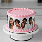 Cake with pink frosting and family photos on a white cake stand.