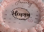 Calendar with decorative pink border and 'Happy' text