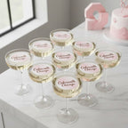 Set of champagne glasses with 'Cakewalk Chicago' label on a white surface.